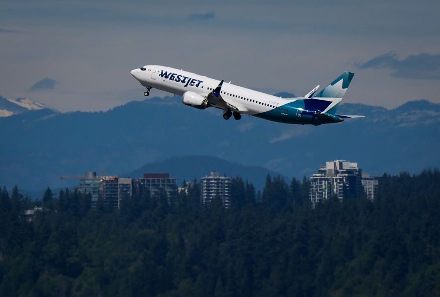 A WestJet Boeing 737 Max aircraft takes off from Vancouver International Airport in Richmond, British Columbia, Canada, on Friday, July 31, 2026. (Darryl Dyck/The Canadian Press via AP)