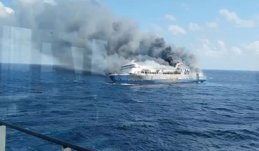 In this photo made from video released by the Indonesian National Search and Rescue Agency (BASARNAS) on Sunday, Aug. 2, 2026, smoke billows from passenger ship Mutiara Santosa 2 after it caught fire in the waters off Madura Island, Indonesia. (BASARNAS via AP)