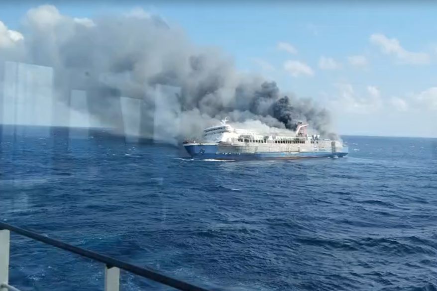 In this photo made from video released by the Indonesian National Search and Rescue Agency (BASARNAS) on Sunday, Aug. 2, 2026, smoke billows from passenger ship Mutiara Santosa 2 after it caught fire in the waters off Madura Island, Indonesia. (BASARNAS via AP)