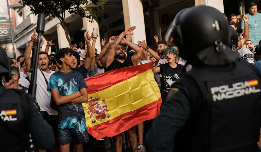 Ceuta residents demonstrate against the arrival of Spanish far-right politician Alvise Pérez in the Spanish enclave of Ceuta, Saturday, Aug. 1, 2026. (AP Photo/Bernat Armangue)