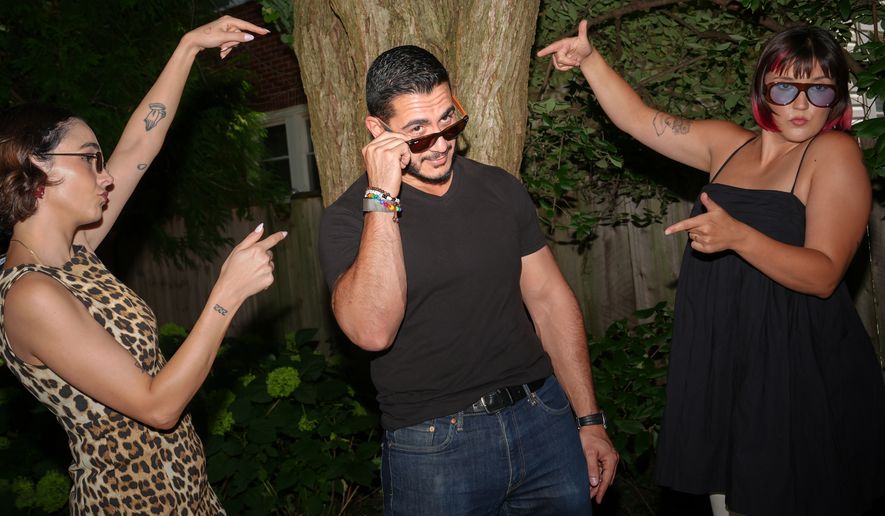 Abdul El-Sayed, a progressive candidate in the Democratic primary for U.S. Senate in Michigan, films a social media video at a pool party for content creators supporting his campaign, Monday, Aug. 3, 2026, in Detroit. (AP Photo/Julia Demaree Nikhinson)