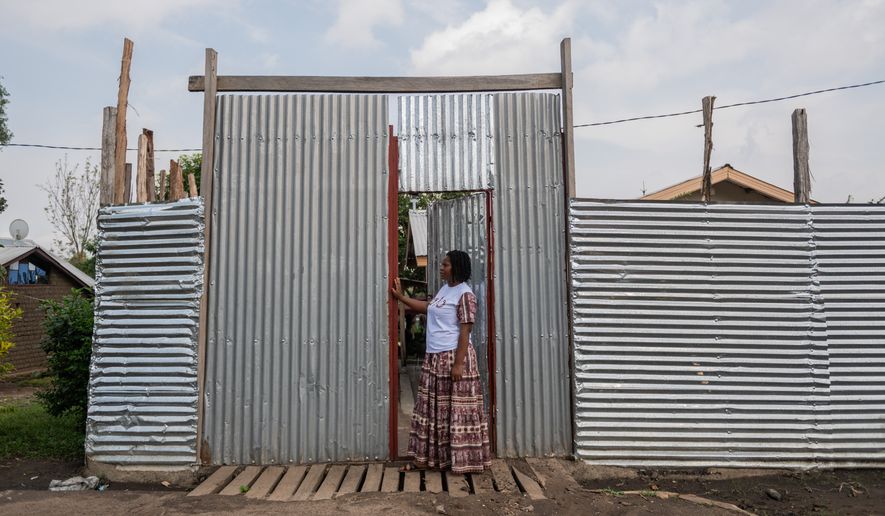 Esther Lutula, a 26-year-old woman who is four months pregnant and a mother of four, who stopped going for prenatal checkups shortly after the current Ebola outbreak, stands outside her house in Bunia, northeastern, Congo, Tuesday, June 16, 2026. (AP Photo/Moses Sawasawa) ** FILE **