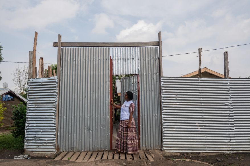 Esther Lutula, a 26-year-old woman who is four months pregnant and a mother of four, who stopped going for prenatal checkups shortly after the current Ebola outbreak, stands outside her house in Bunia, northeastern, Congo, Tuesday, June 16, 2026. (AP Photo/Moses Sawasawa) ** FILE **