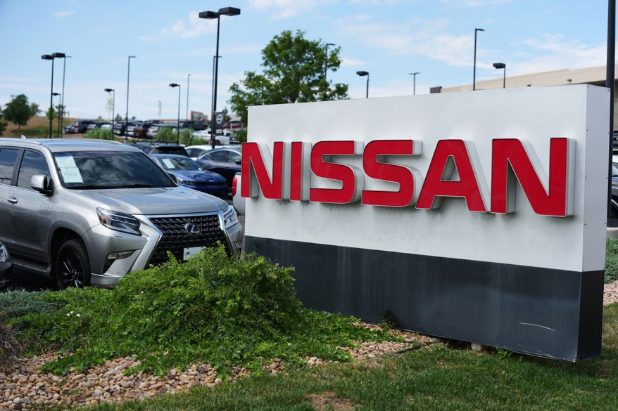 FILE - Sign carrying the corporate logo stands outside a Nissan dealership Monday, July 27, 2026, in Highlands Ranch, Colo. (AP Photo/David Zalubowski, file)
