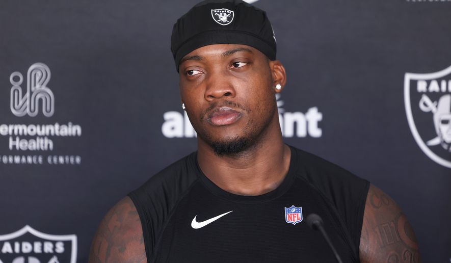Las Vegas Raiders linebacker Quay Walker (7) speaks during a news conference at the team's NFL football training camp, Thursday, July 30, 2026, in Henderson, Nev. (AP Photo/Ian Maule)