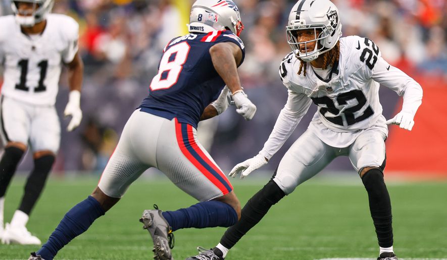 FILE - Las Vegas Raiders cornerback Eric Stokes (22) covers New England Patriots wide receiver Stefon Diggs (8) during the second half of an NFL football game Sept. 7, 2025, in Foxborough, Mass. (AP Photo/Greg M. Cooper, File)