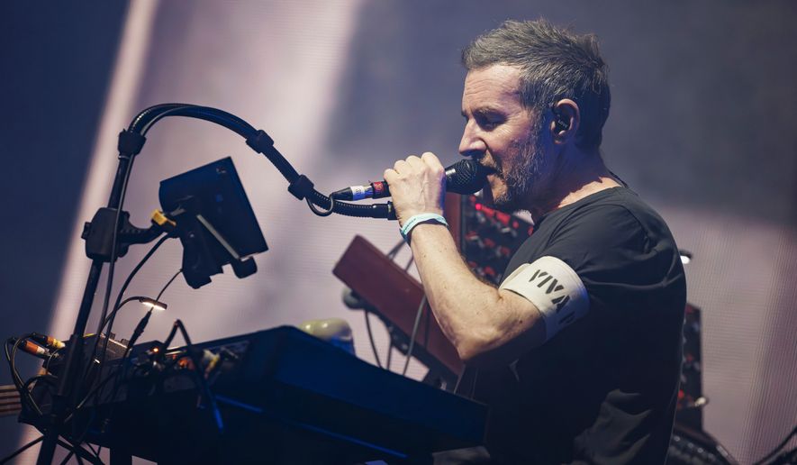 FILE - Robert Del Naja of the British Trip Hop collective Massive Attack performs on the Lake stage during the 58th Montreux Jazz Festival (MJF), in Montreux, Switzerland, July 15, 2024. (Valentin Flauraud/Keystone via AP, File)