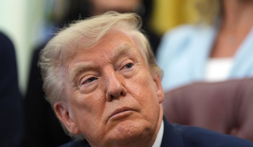 President Donald Trump listens during a meeting about military families, in the Oval Office of the White House, Monday, Aug. 3, 2026, in Washington. (AP Photo/Alex Brandon)
