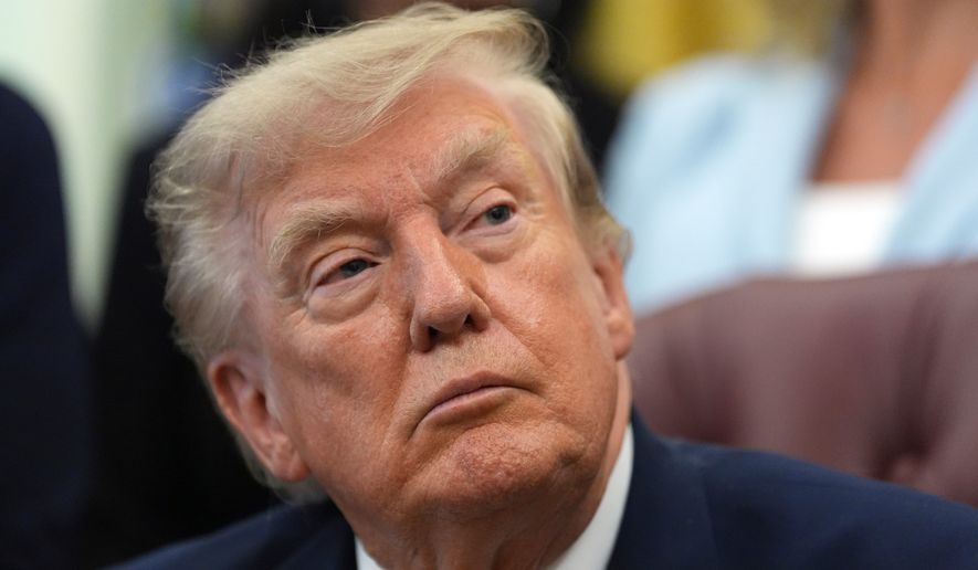 President Donald Trump listens during a meeting about military families, in the Oval Office of the White House, Monday, Aug. 3, 2026, in Washington. (AP Photo/Alex Brandon)