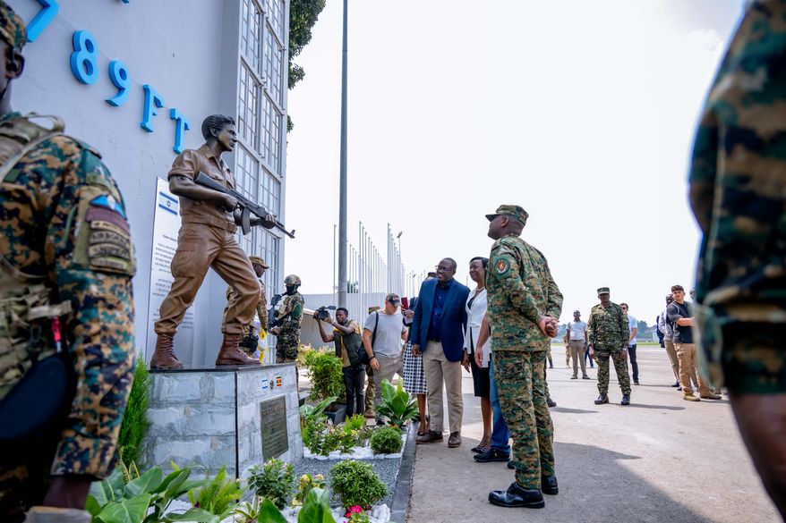 Uganda's military chief, Gen. Muhoozi Kainerugaba unveils a monument honoring the late Yoni Netanyahu, brother of Israeli Prime Minister Benjamin Netanyahu, at the old terminal of Entebbe International Airport in Entebbe, Uganda, Saturday, Aug. 1, 2026. (Uganda People's Defence Forces Press Service via AP)