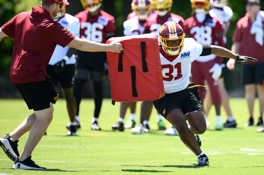 Washington Commanders running back Kaytron Allen (31) works out during NFL football practice, Tuesday, June 2, 2026, in Ashburn, Va. (AP Photo/Nick Wass)