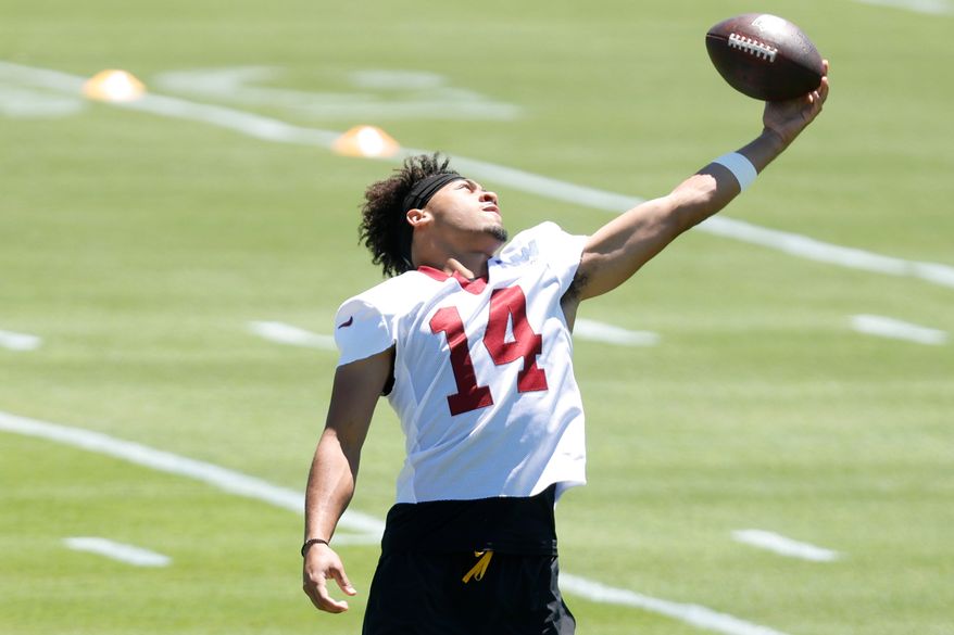 Washington Commanders wide receiver Antonio Williams (14) warms up during an NFL football practice at the team's training facility in Ashburn, Va., Tuesday, June 16, 2026.(AP Photo/Luis M. Alvarez)