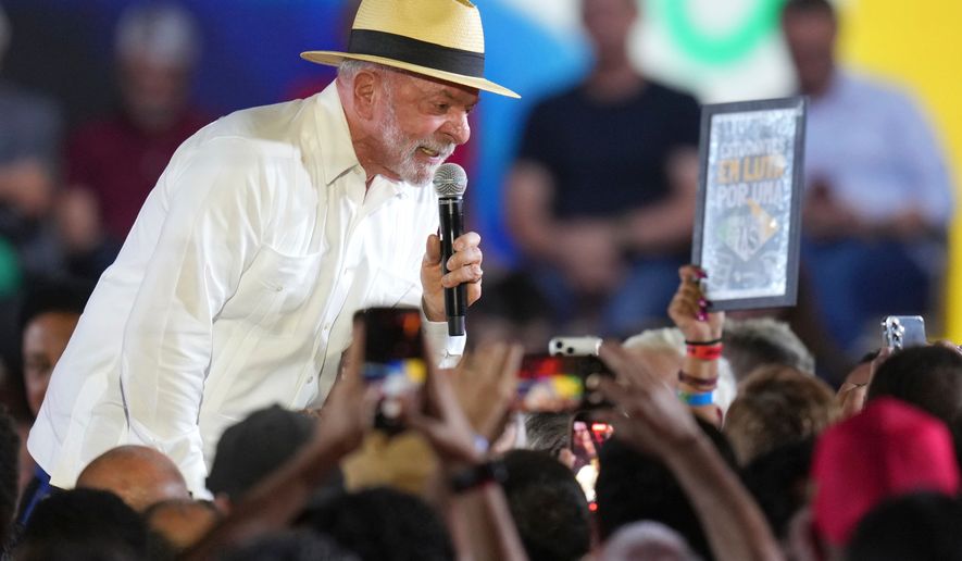 Brazilian President Luiz Inacio Lula da Silva speaks to supporters during the Workers' Party convention, where he was confirmed as the party's presidential candidate for the next election in Sao Paulo, Brazil, Sunday, Aug. 2, 2026. (AP Photo/Andre Penner)