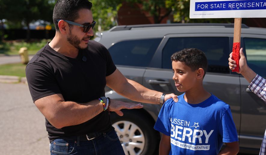 Abdul El-Sayed, a progressive candidate in the Democratic primary for U.S. Senate in Michigan, visits a polling place at Salina Intermediate School on primary election day, Tuesday, Aug. 4, 2026, in Dearborn, Mich. (AP Photo/Julia Demaree Nikhinson)