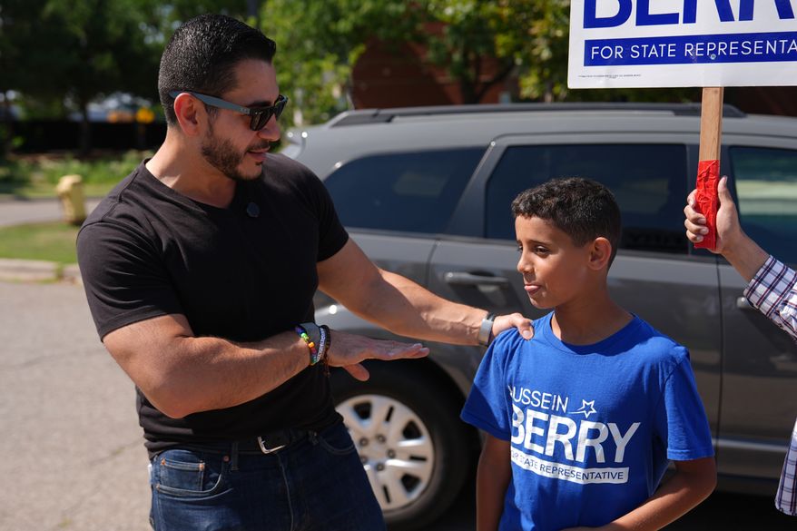 Abdul El-Sayed, a progressive candidate in the Democratic primary for U.S. Senate in Michigan, visits a polling place at Salina Intermediate School on primary election day, Tuesday, Aug. 4, 2026, in Dearborn, Mich. (AP Photo/Julia Demaree Nikhinson)