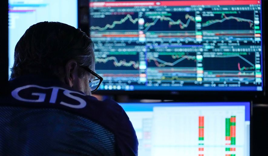 A trader works on the floor of the New York Stock Exchange, Thursday, July 30, 2026, in New York. (AP Photo/Yuki Iwamura)