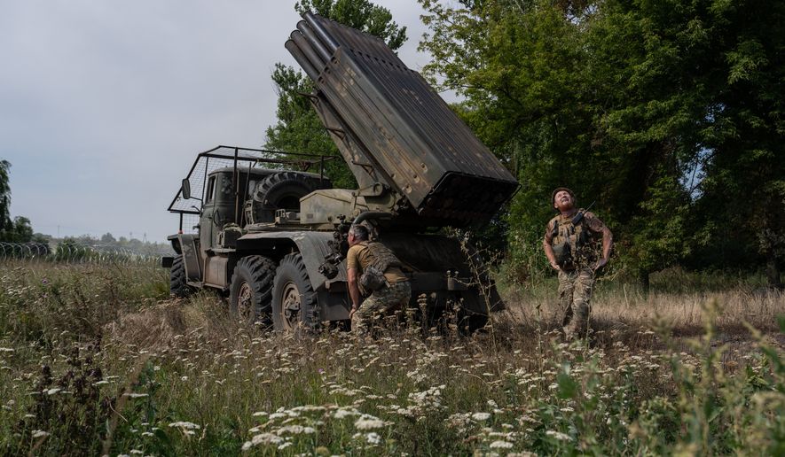 In this photo provided by Ukraine's 93rd Kholodnyi Yar Separate Mechanized Brigade press service, soldiers prepare an MRLS BM-21 "Grad" to fire at Russian positions near the frontline city of Kramatorsk, Donetsk region, Ukraine, Tuesday, Aug. 4, 2026. (Iryna Rybakova/Ukraine's 93rd Mechanized Brigade via AP)