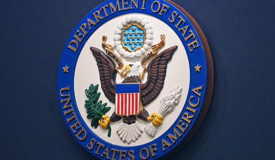 The State Department seal is seen on the briefing room lectern at the State Department in Washington, Jan. 31, 2022. (Mandel Ngan, Pool via AP, File)