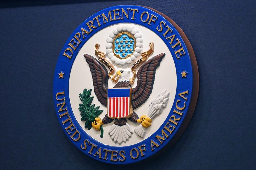 The State Department seal is seen on the briefing room lectern at the State Department in Washington, Jan. 31, 2022. (Mandel Ngan, Pool via AP, File)