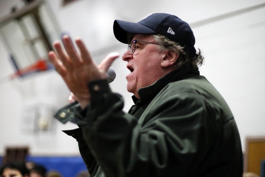 Filmmaker Michael Moore speaks to the overflow crowd before a rally for Democratic presidential candidate Sen. Bernie Sanders, I-Vt., at the Ames City Auditorium in Ames, Iowa, Jan. 25, 2020. (AP Photo/Gene J. Puskar)