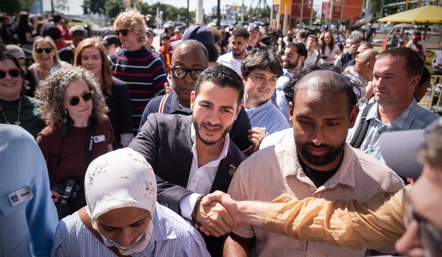 Abdul El-Sayed departs following a news conference at the Spirit of Detroit shortly after winning the Democratic nomination for U.S. Senate in Michigan, Wednesday, Aug. 5, 2026, in Detroit. (AP Photo/Julia Demaree Nikhinson)