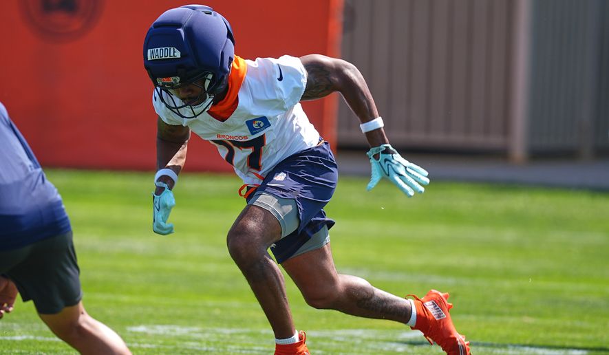 Denver Broncos wide receiver Jaylen Waddle takes part in drills during a practice at the team's NFL football training camp Friday, July 31, 2026, in Centennial, Colo. (AP Photo/David Zalubowski)