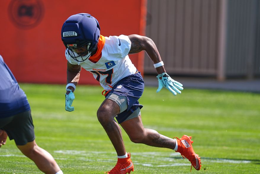 Denver Broncos wide receiver Jaylen Waddle takes part in drills during a practice at the team's NFL football training camp Friday, July 31, 2026, in Centennial, Colo. (AP Photo/David Zalubowski)