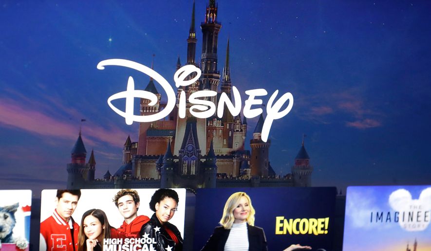 FILE - In this Nov. 13, 2019 file photo, a Disney logo forms part of a menu for the Disney Plus movie and entertainment streaming service on a computer screen in Walpole, Mass. (AP Photo/Steven Senne, File)