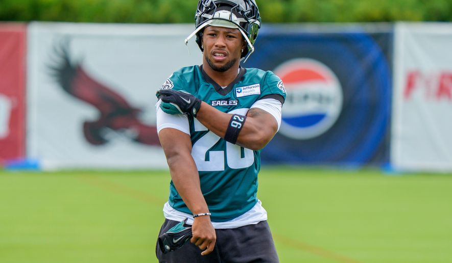 Philadelphia Eagles running back Saquon Barkley (26) looks on during practice at the team's NFL football training camp in Philadelphia, Thursday, July 30, 2026. (AP Photo/Chris Szagola)