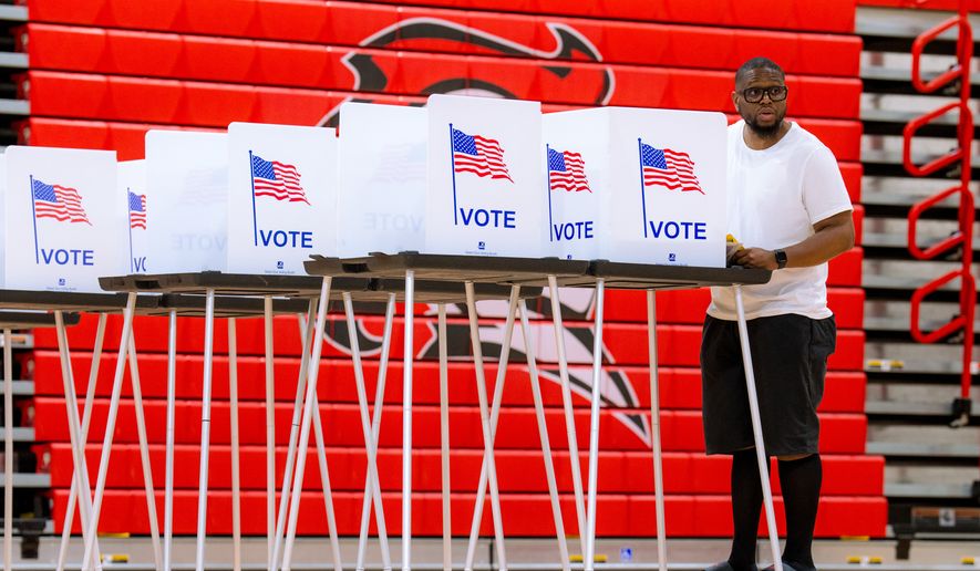 A person votes in the primary election at Oak Park High School in Oak Park, Mich., Tuesday, Aug. 4, 2026. (AP Photo/Nic Antaya)