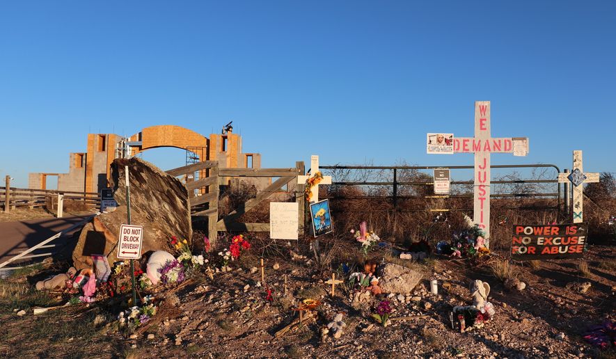 Crosses, flowers and other mementos are displayed outside Jeffrey Epstein's former Zorro Ranch near Stanley, N.M., on Friday, April 3, 2026. (AP Photo/Savannah Peters) ** FILE **