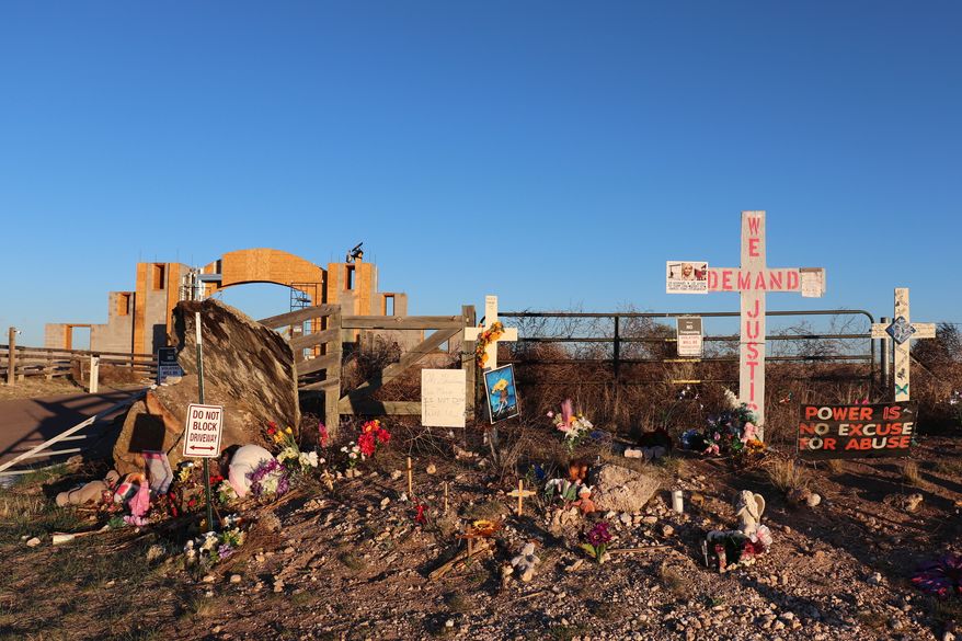 Crosses, flowers and other mementos are displayed outside Jeffrey Epstein's former Zorro Ranch near Stanley, N.M., on Friday, April 3, 2026. (AP Photo/Savannah Peters) ** FILE **