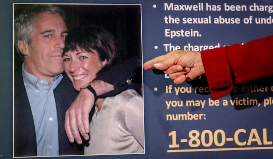 FILE - Audrey Strauss, acting U.S. attorney for the Southern District of New York, points to a photo of Jeffrey Epstein and Ghislaine Maxwell during a news conference in New York on July 2, 2020. (AP Photo/John Minchillo, File)