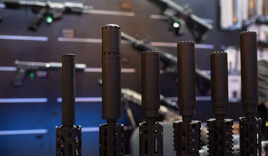 Firearms and suppressors are displayed at SHOT Show, the annual trade show for the gun industry, in Las Vegas on Jan. 21 2020. (AP Photo/Lisa Marie Pane) **FILE**