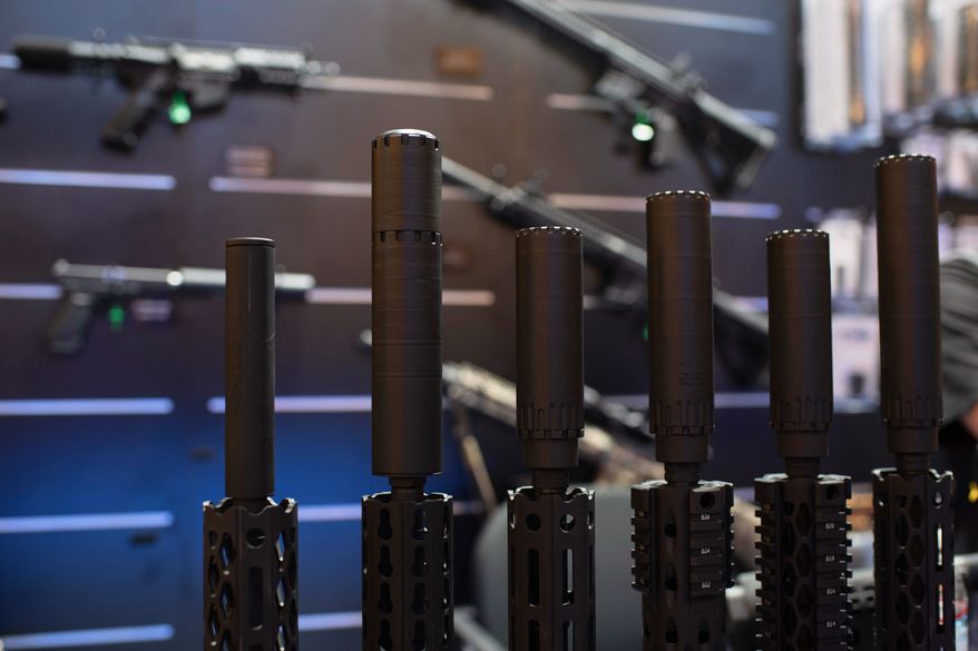 Firearms and suppressors are displayed at SHOT Show, the annual trade show for the gun industry, in Las Vegas on Jan. 21 2020. (AP Photo/Lisa Marie Pane) **FILE**