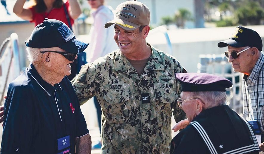 U.S. Navy Captain Brian Binder (center) is shown speaking with veterans attending a ceremony marking the 81st anniverary of the atomic bombing of Hiroshima. (Credit: Courtesy U.S. Navy)