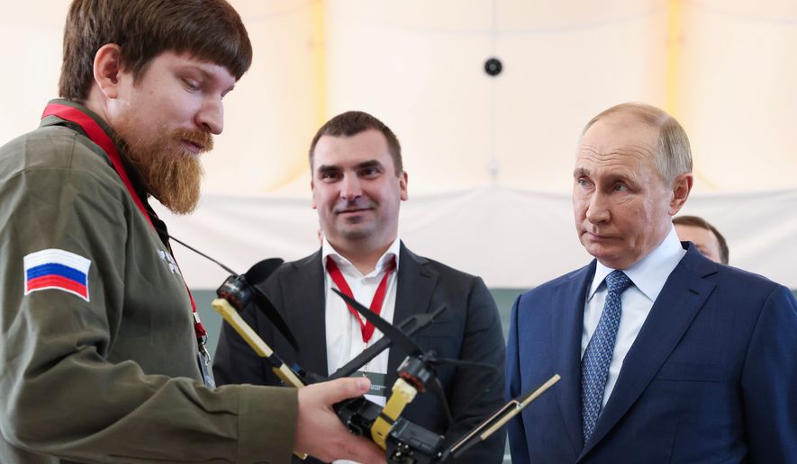 FILE - Russian President Vladimir Putin, right, speaks with Vladimir Tkachuk, the head of the Uraldronzavod, during his visit to the Special Technology Centre in St. Petersburg, Russia, Thursday, Sept. 19, 2024. (Valeriy Sharifulin, Sputnik, Kremlin Pool Photo via AP, File)