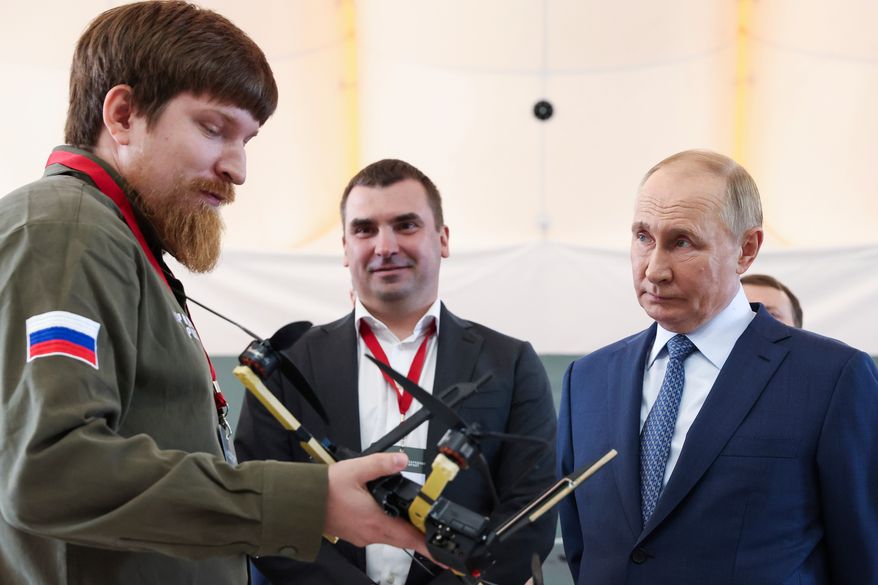 FILE - Russian President Vladimir Putin, right, speaks with Vladimir Tkachuk, the head of the Uraldronzavod, during his visit to the Special Technology Centre in St. Petersburg, Russia, Thursday, Sept. 19, 2024. (Valeriy Sharifulin, Sputnik, Kremlin Pool Photo via AP, File)