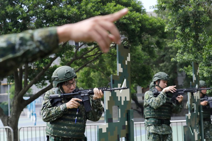 Soldiers conduct shooting training during the annual Han Kuang military exercises in Taipei, Taiwan, Wednesday, Aug. 5, 2026. (AP Photo/Chiang Ying-ying)