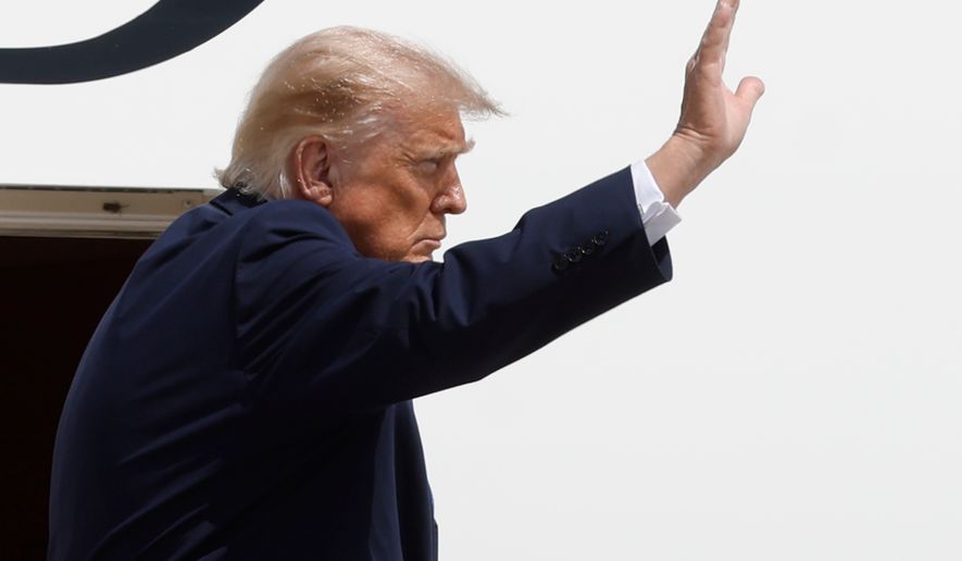 President Donald Trump waves from the stairs of Air Force One at Joint Base Andrews, Md., Tuesday, Aug. 4, 2026.(AP Photo/Luis M. Alvarez)