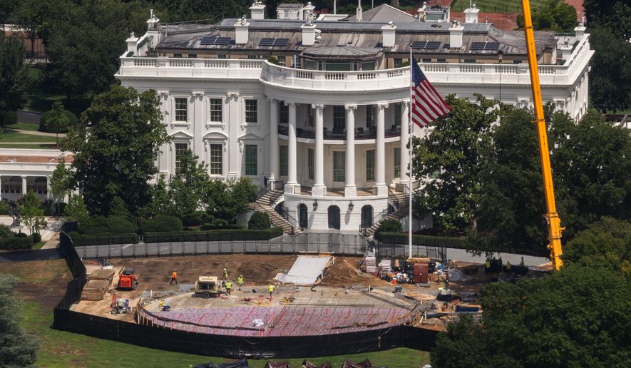 Construction continues on a helipad on the South Lawn of the White House, Wednesday, Aug. 5, 2026, in Washington. (AP Photo/Tierney L. Cross)