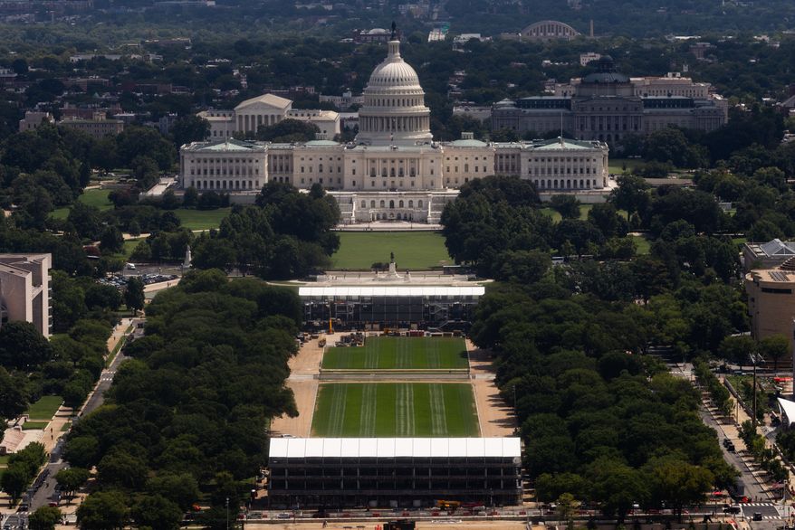 Construction for the Freedom 250 Grand Prix on the National Mall is seen from the Washington Monument, Wednesday, Aug. 5, 2026, in Washington. (AP Photo/Tierney L. Cross)