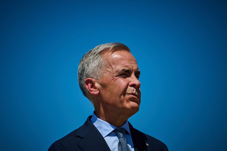 Prime Minister Mark Carney attends a housing announcement in Toronto, on Wednesday, Aug. 5, 2026. (Sammy Kogan/The Canadian Press via AP)