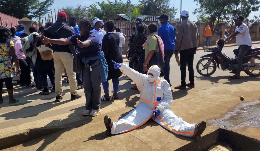 Health workers at the epicenter of Ebola outbreak protest over unpaid wages at the provincial governor's office in Ituri, eastern Congo, Thursday, Aug. 6, 2026. (AP Photo/Constant Same Bagalwa)