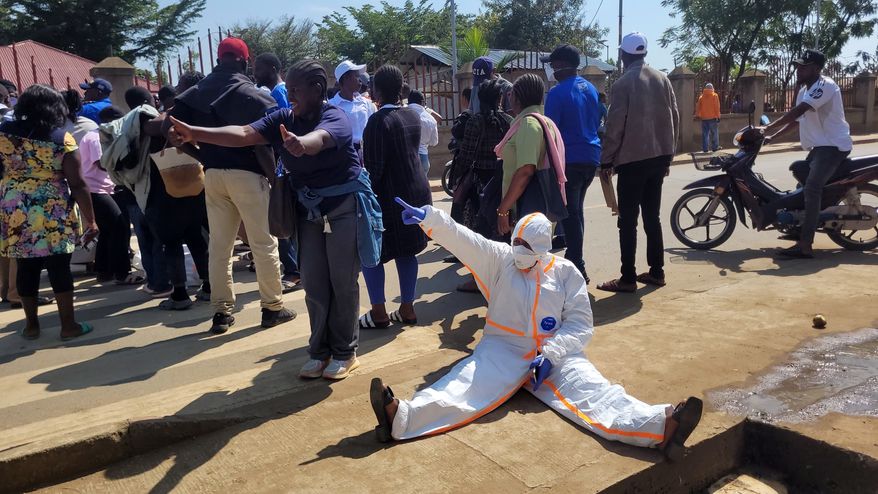 Health workers at the epicenter of Ebola outbreak protest over unpaid wages at the provincial governor's office in Ituri, eastern Congo, Thursday, Aug. 6, 2026. (AP Photo/Constant Same Bagalwa)