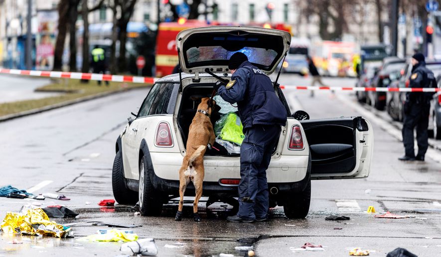 FILE - Emergency services attend the scene of a car-ramming attack in Munich, Germany, Thursday Feb. 13, 2025. (Matthias Balk/dpa via AP, File)