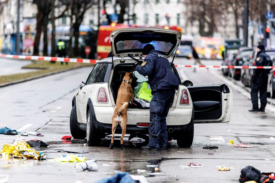 FILE - Emergency services attend the scene of a car-ramming attack in Munich, Germany, Thursday Feb. 13, 2025. (Matthias Balk/dpa via AP, File)