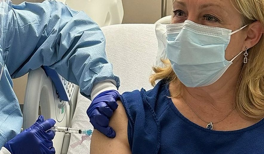 In this photo provided by Dr. Stacy Norton, she receives a trial vaccine for Lynch Syndrome at the MD Anderson Cancer Center Infusion Center in Houston, on April 11, 2023. (Courtesy Dr. Stacy Norton via AP)