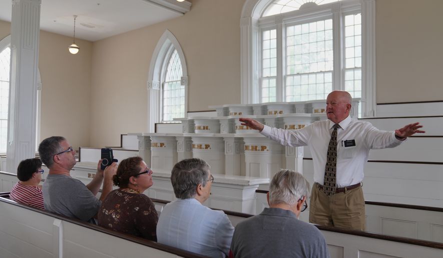Elder Brian Garner leads a tour of the Kirtland temple site, a nearly two-century old sanctuary considered the first temple in the movement Joseph Smith founded, on Wednesday, June 15, 2026, in Kirtland, Ohio. (AP Photo/Jessie Wardarski)
