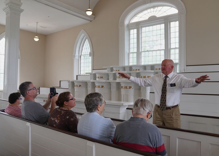 Elder Brian Garner leads a tour of the Kirtland temple site, a nearly two-century old sanctuary considered the first temple in the movement Joseph Smith founded, on Wednesday, June 15, 2026, in Kirtland, Ohio. (AP Photo/Jessie Wardarski)